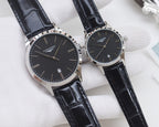 Longines watches with black leather straps and black dials, silver cases, two watches