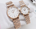 Rose gold Longines watches with white dials and linked metal bracelets, two views together
