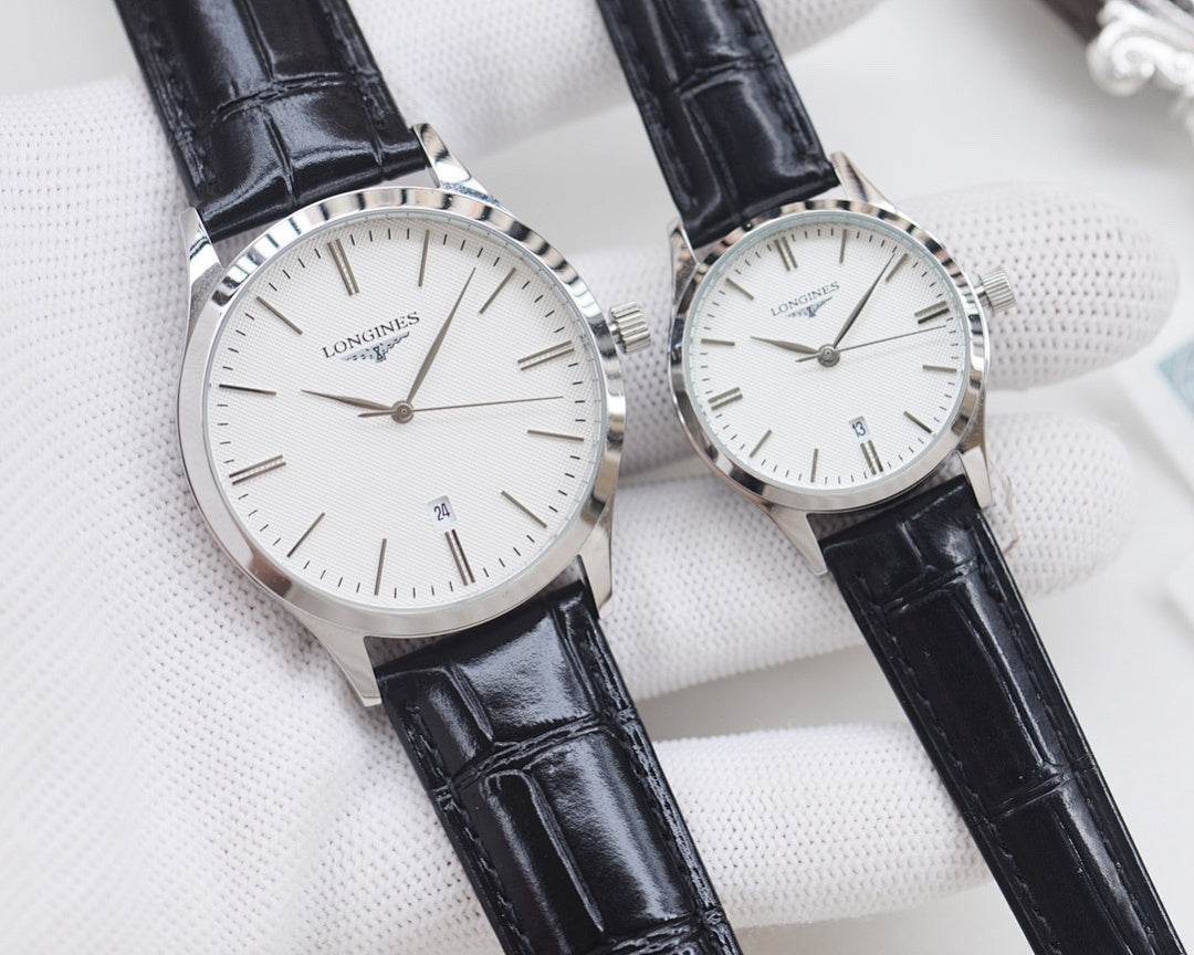 Longines watches with black leather straps, white dials, and silver cases, two watches