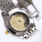 Longines automatic wristwatch case back with gold-toned rotor and exposed movement