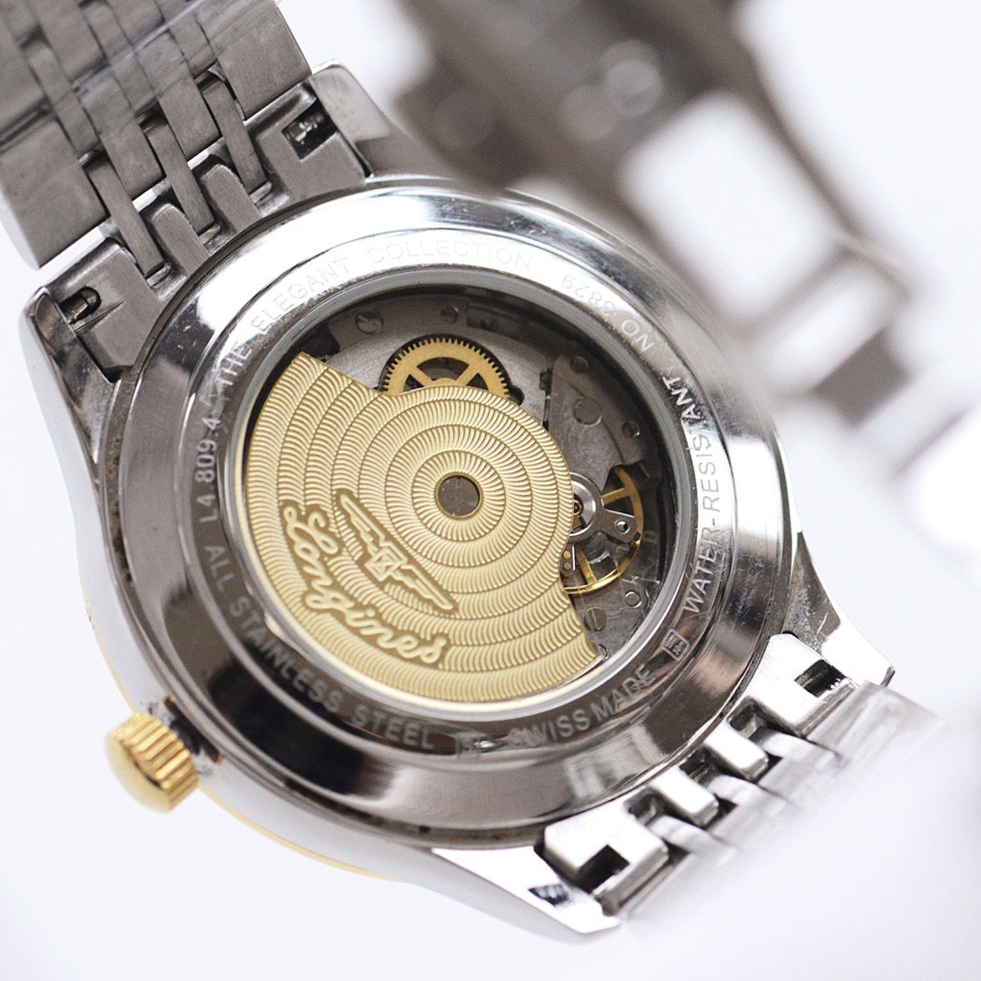 Longines automatic wristwatch case back with gold-toned rotor and exposed movement