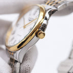 Longines wristwatch side profile with gold-tone accents and crown
