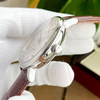 Longines watch side view with clear crystal and brown leather strap.