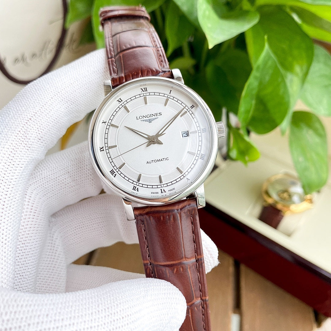 Longines watch with white dial and brown leather strap, silver-tone case.