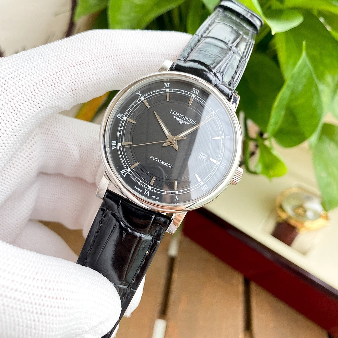 Longines watch with dark gray dial and black leather strap, silver-tone case.