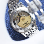 Longines watch caseback in metal with exposed movement and rotor