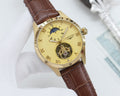Longines timepiece, gold dial, brown leather strap, open-heart skeleton movement