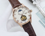 Longines wristwatch, light dial with blue accents, brown leather strap, skeleton center