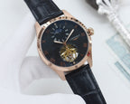 Longines wristwatch, dark dial with gold-toned accents, black leather strap, open-heart view