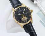 Longines timepiece, black dial, black leather strap, gold tone case, open-heart movement