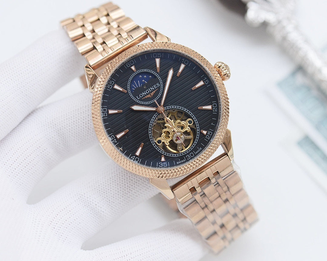 Gold-tone Longines wristwatch with dark blue dial and metal bracelet, open-work subdial