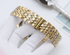 Gold-tone Longines metal bracelet band with linked clasp, shown side view