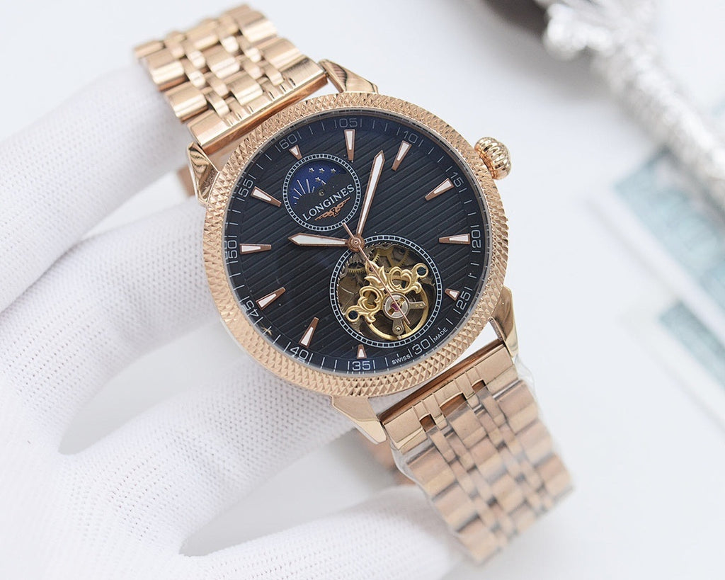 Gold-tone Longines wristwatch with dark blue dial and metal bracelet, textured bezel