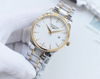 Two-tone stainless steel wristwatch with white dial, gold indices, on white glove