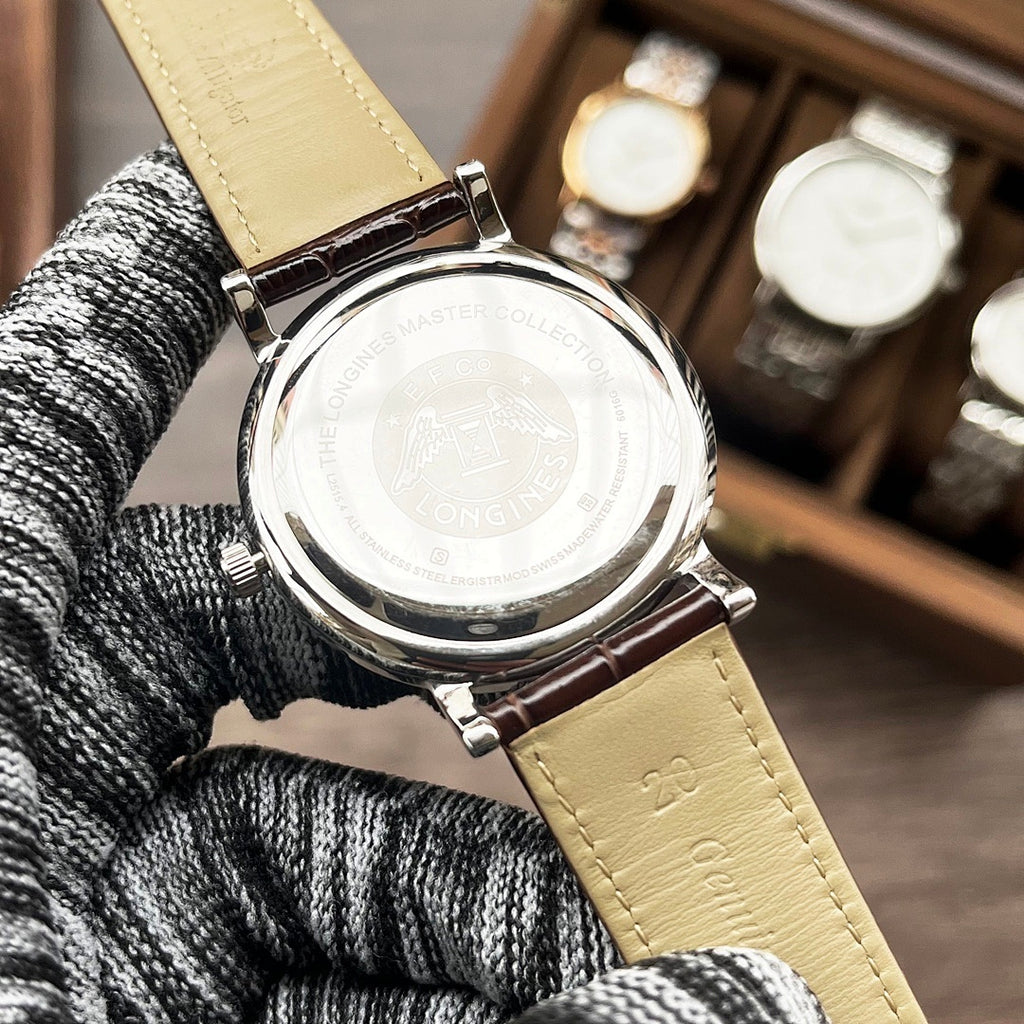 Longines wristwatch case with gold leather strap, round engraved case back