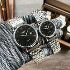 Longines wristwatch, silver-tone metal bracelet, black dial with Roman numerals