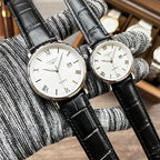 Longines wristwatch, black leather strap, white dial with Roman numerals and date window