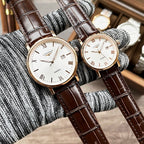 Longines wristwatch, brown leather strap, white dial with Roman numerals and date window