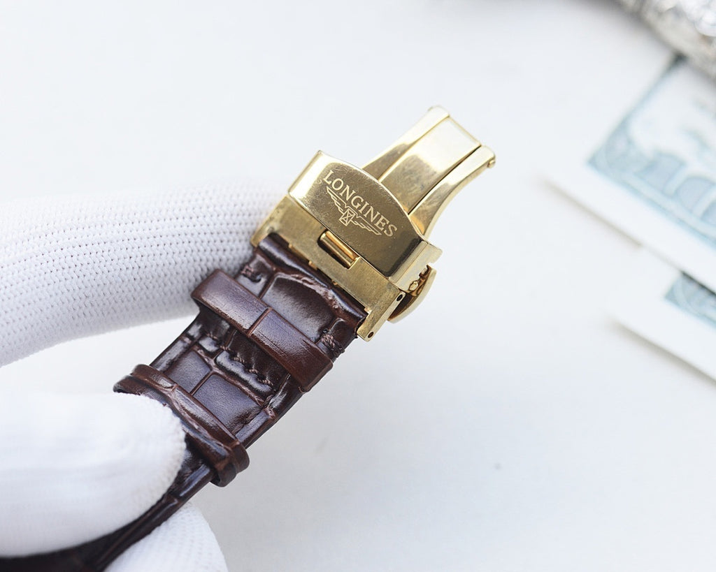 Longines watch with brown leather strap and gold-tone clasp and end links