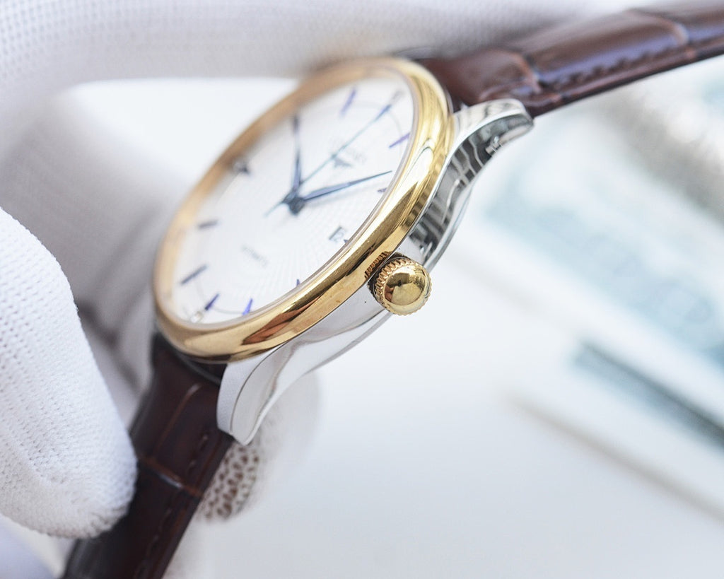 Longines watch with gold-tone bezel, brown leather strap, white dial, visible crown