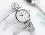 Longines watch with silver metal bracelet and white dial, slim round case
