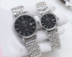 Two Longines watches with rose-gold bezels, silver bracelets, dark watch faces