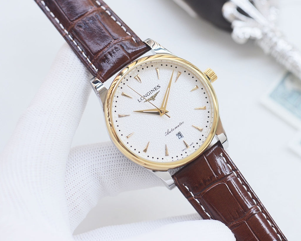 Analog watch with white dial, brown leather strap, gold case, slim baton markers.