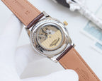 Longines watch caseback with visible mechanical movement, brown leather strap and clasp.