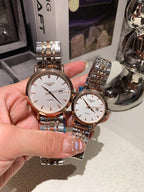 Longines watch pair with silver metal bracelet; white dials and rose-gold accents