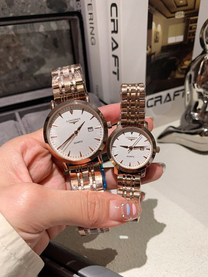 Longines watch pair with silver metal bracelets; white dials and rose-gold case accents