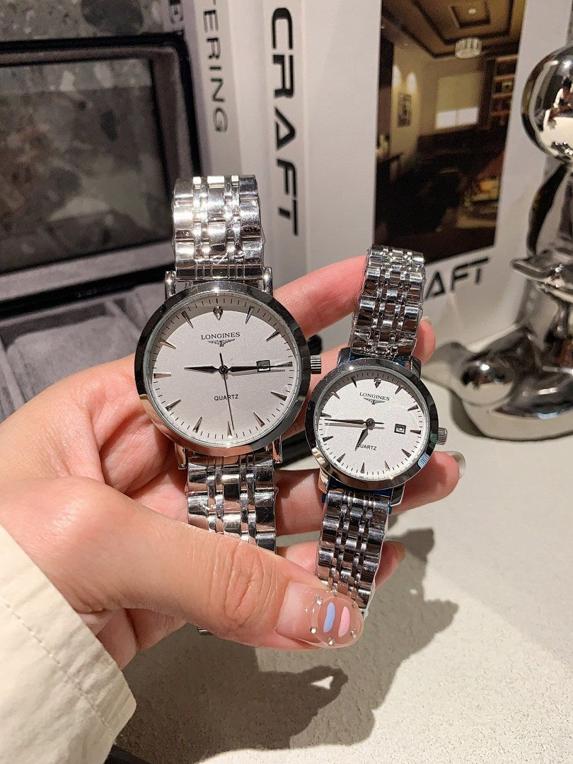 Longines watch pair with silver metal bracelets; white dials and gold-toned bezels