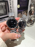 Longines watch pair with silver metal bracelets; black dials and rose-gold case accents