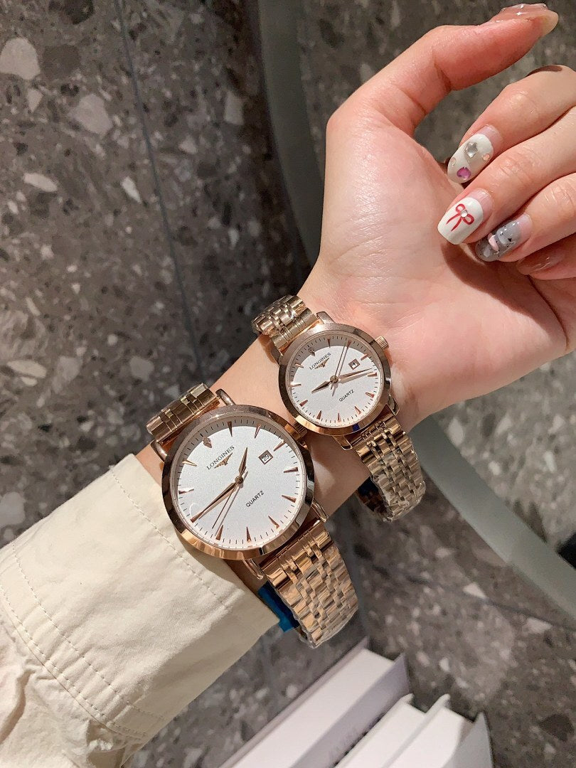 Longines watch pair with rose-gold tone cases, silver bracelets, and white dials