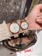 Longines wrist watches with rose-gold tone metal bracelets and white dials, one shown upright