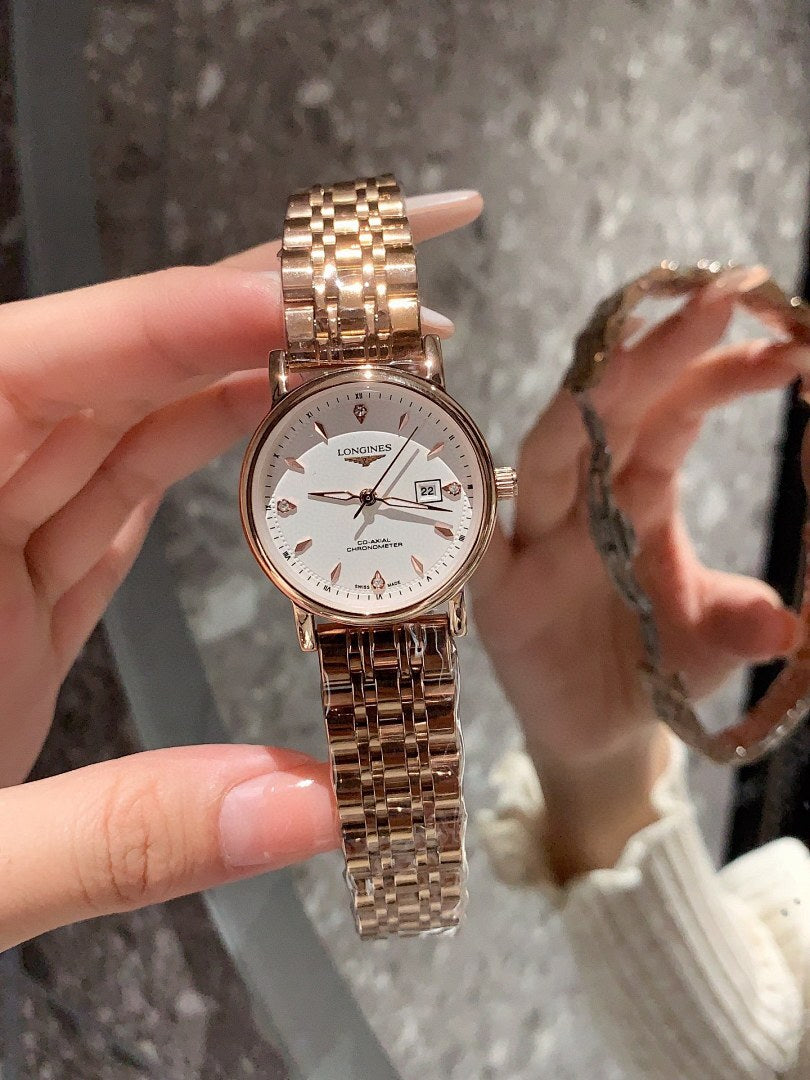 Longines rose-gold tone wrist watch with white dial, metal bracelet, date window visible
