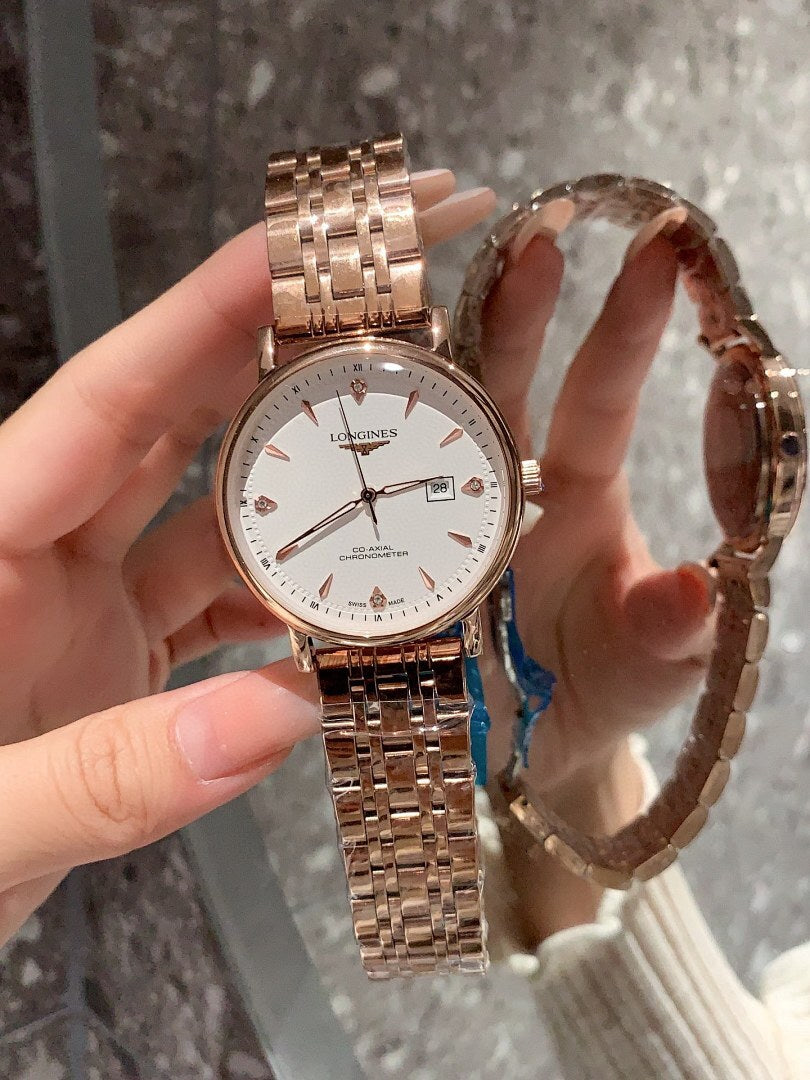 Longines rose-gold tone wrist watch with white dial and metal bracelet, side profile view