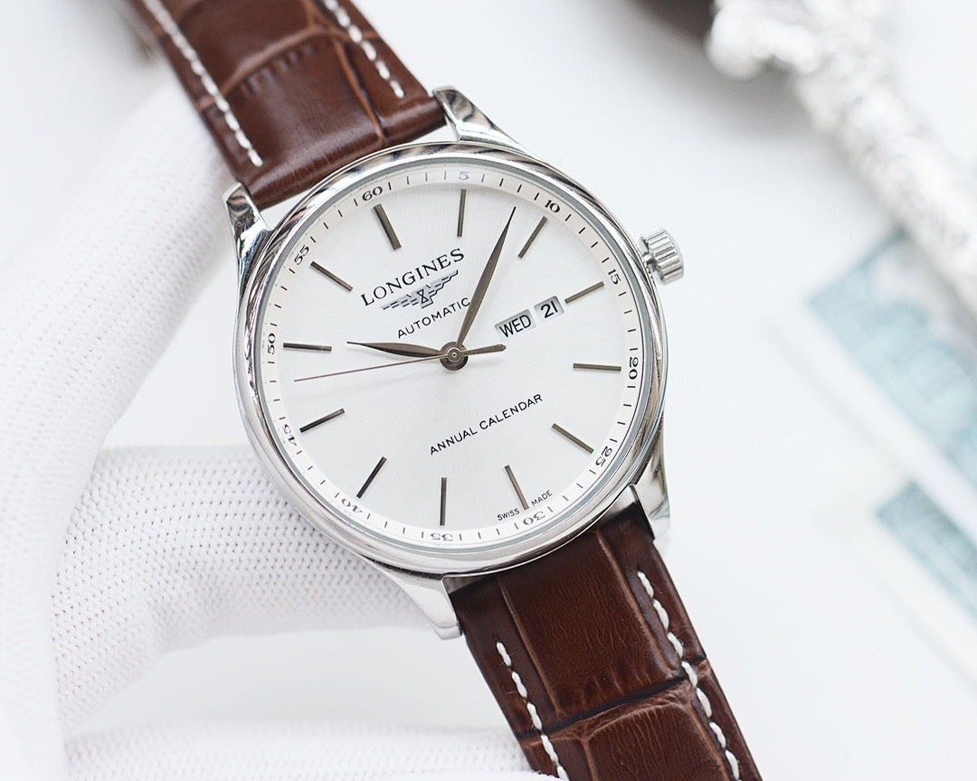 Longines automatic watch with white dial, brown leather strap, silver case and calendar display