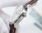 Longines watch side profile with round crown and brown leather strap