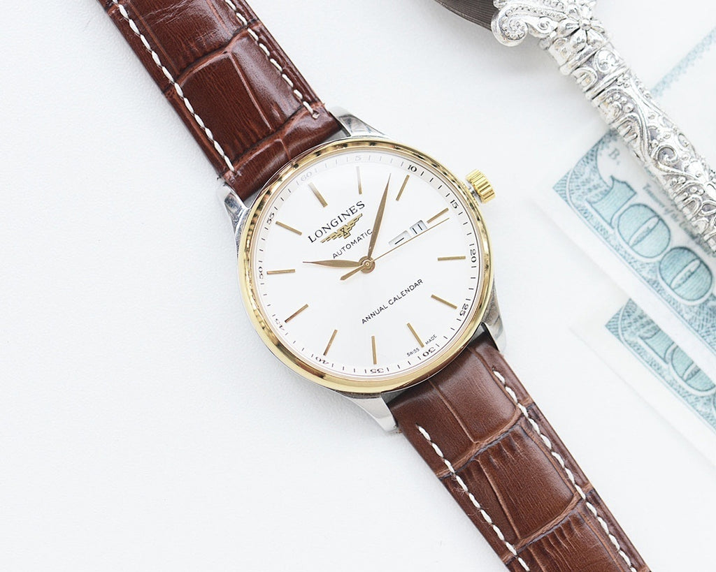 Longines automatic watch with white dial, brown leather strap, gold-tone case and crown