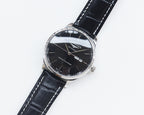 Longines automatic watch with black dial and black leather strap, round silver case