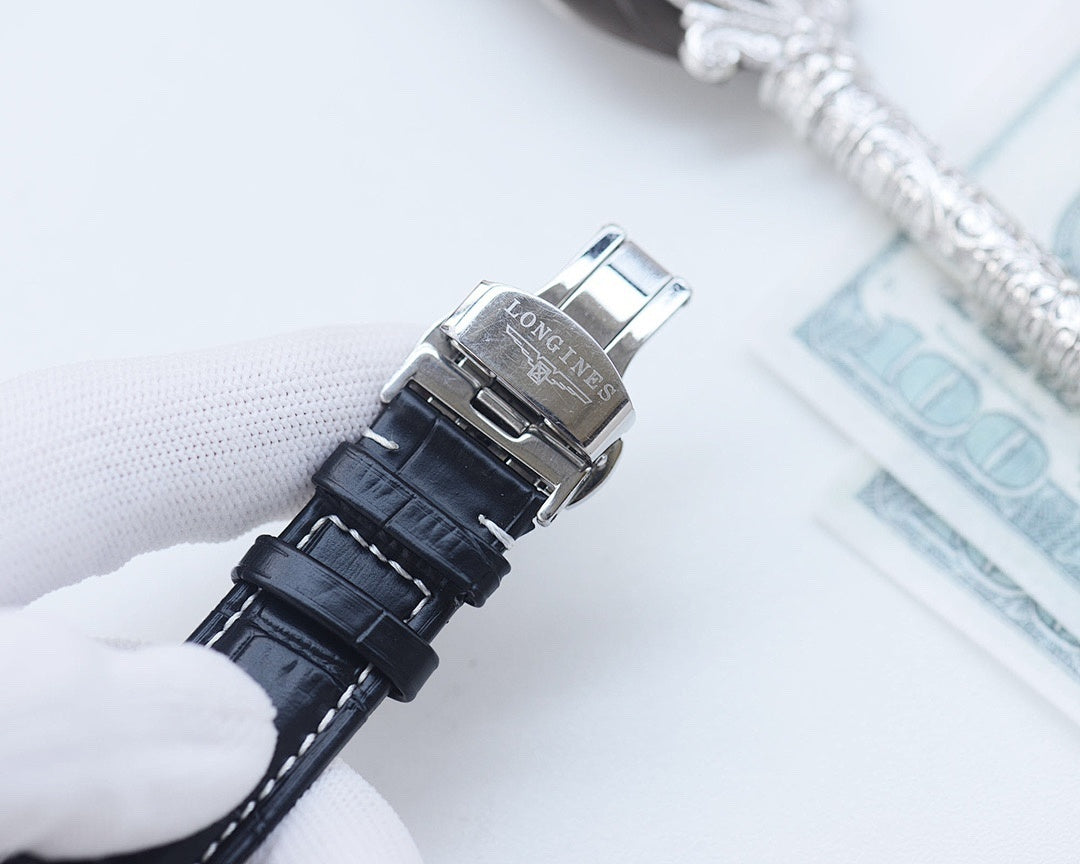 Longines watch clasp with stacked leather straps and silver-toned buckle hardware