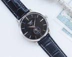 Longines watch with black dial, black leather strap, and silver round case