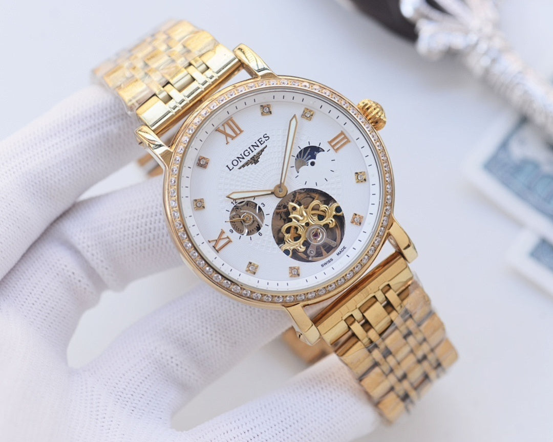 Gold-tone metal watch with white dial, diamond bezel, and skeleton movement