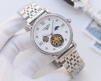 Silver-tone metal watch with white dial, diamond bezel, and visible skeleton movement