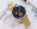 Gold-tone metal watch with dark blue dial, diamond bezel, and skeleton hands