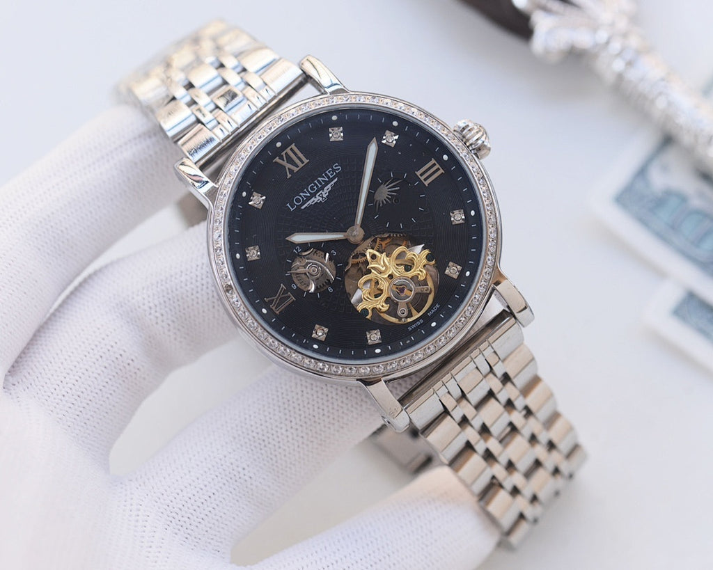 Silver-tone metal watch with dark blue dial, diamond bezel, and skeleton movement