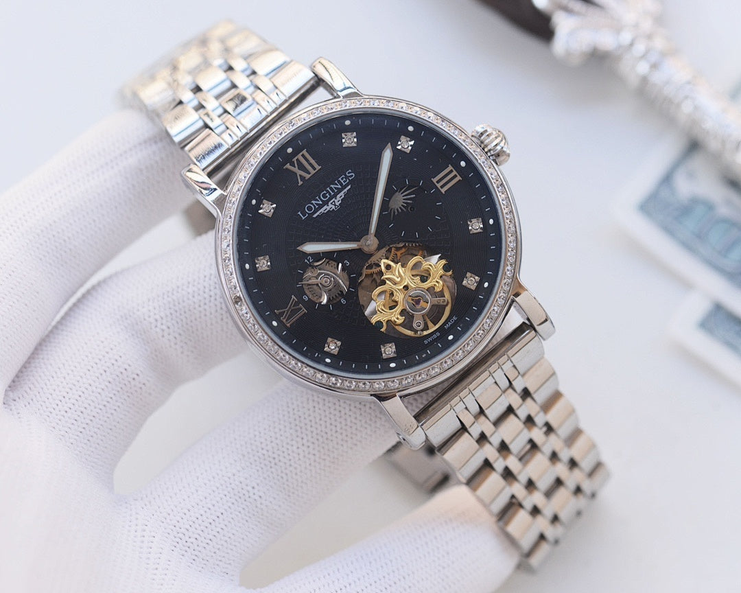 Silver-tone metal watch with dark blue dial, diamond bezel, and skeleton movement