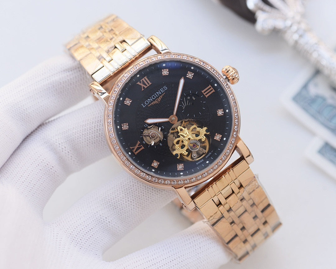 Gold-tone metal watch with dark blue dial, gold hands, and skeleton movement