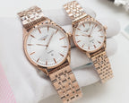 Quartz wristwatches with white dial and rose-gold tone metal bracelet, two-pack.
