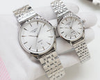 Quartz wristwatches with white dial and silver metal link bracelet, two-pack.